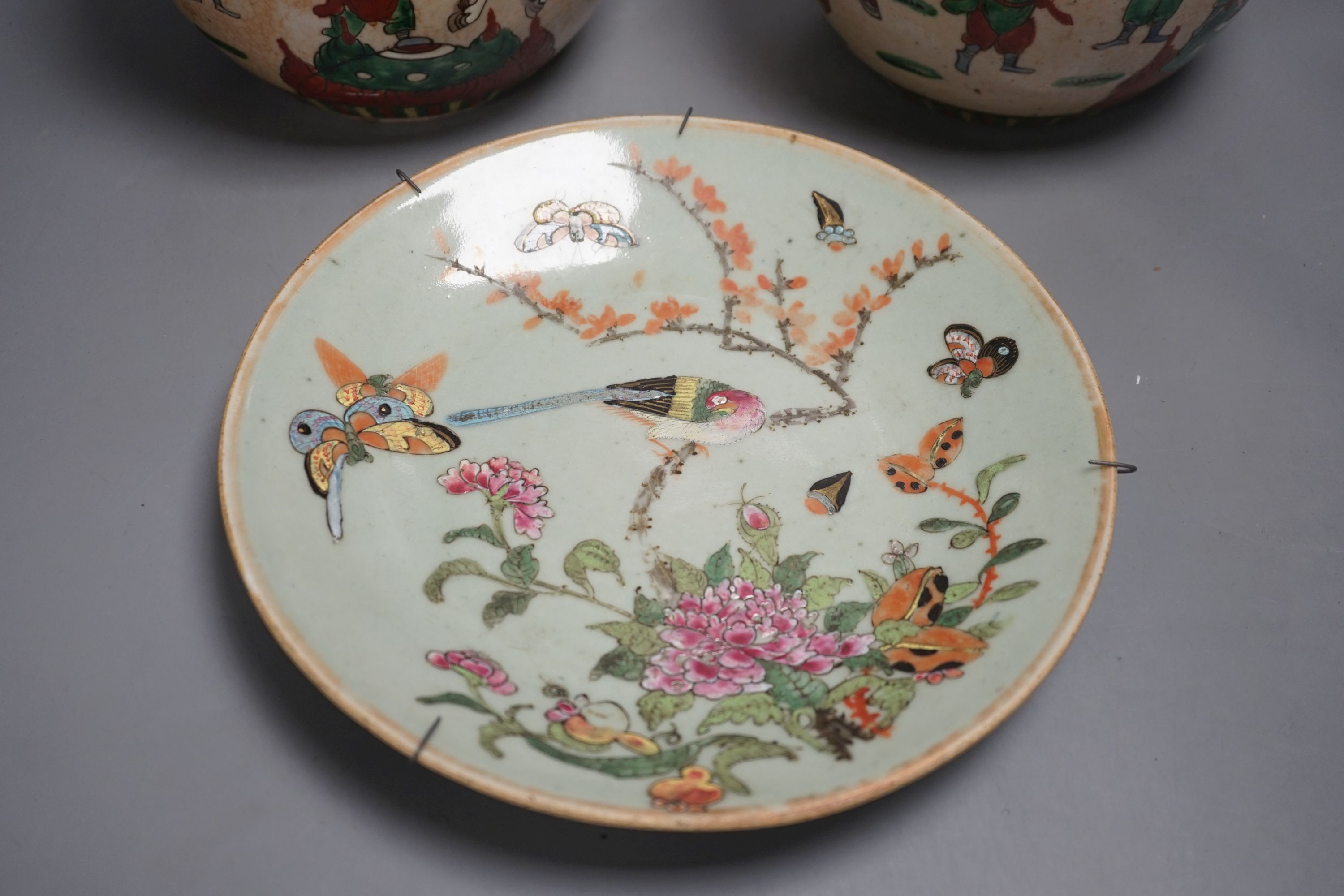 A pair of Chinese crackleware ginger jars, 20cm tall, and a celadon plate